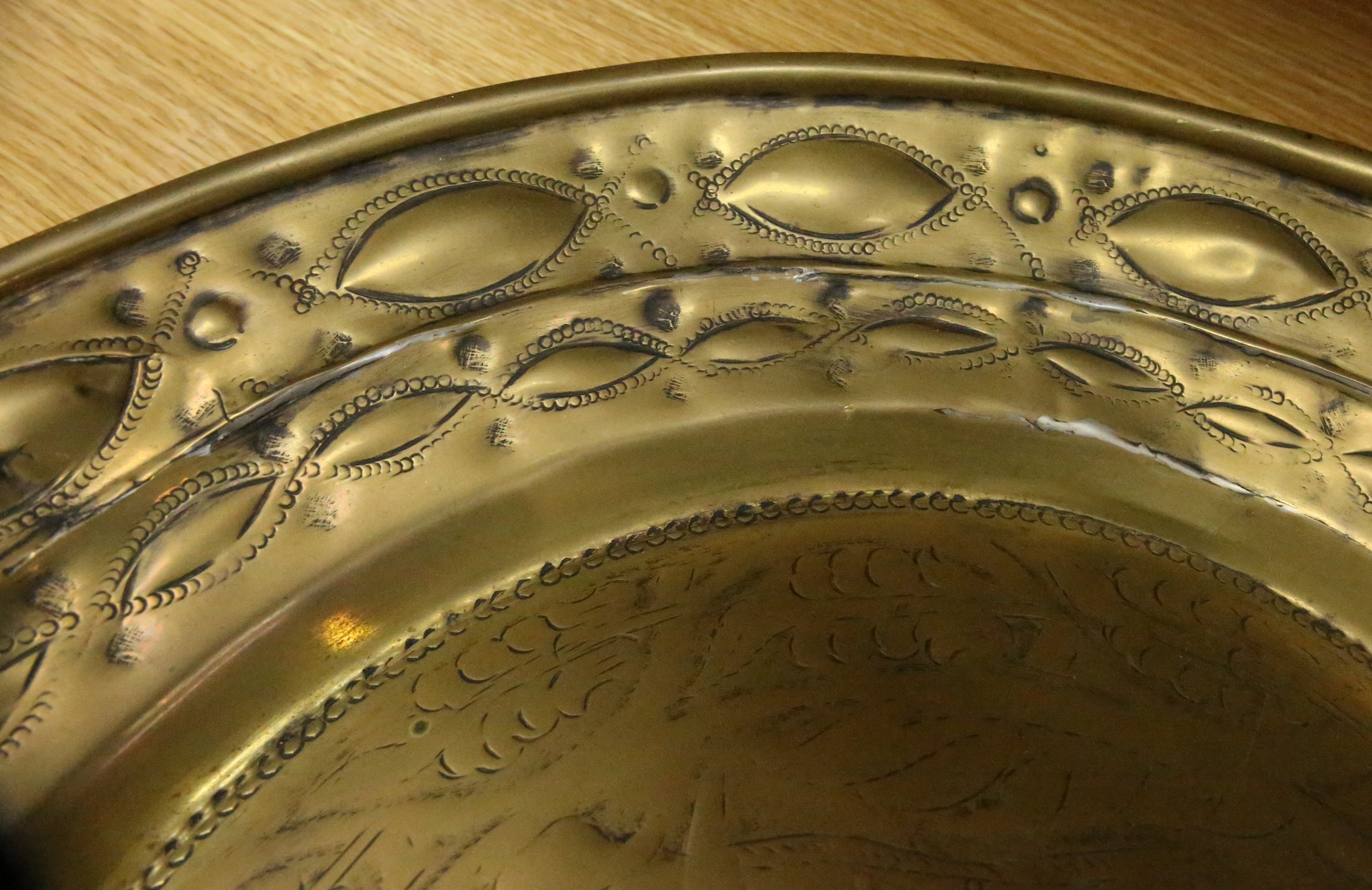 A 17th century Nuremberg brass alms dish, 43cm diameter. Condition - good for age